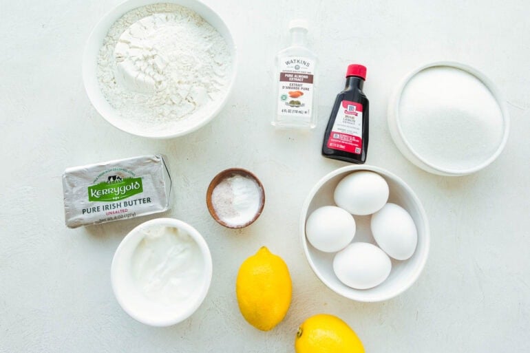 Photo of all the ingredients for Lemon Pound Cake including fresh lemons, eggs, flour, sugar and more