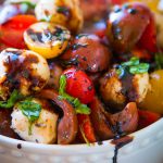 This easy tomato mozzarella salad is so refreshing and perfect for a spring or summer side dish, plus you can make it a few different ways! ohsweetbasil.com