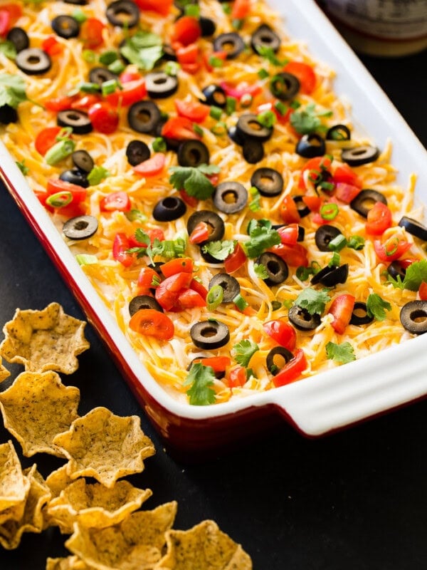 Whether it's football game day in the fall or winter, there's nothing better than wandering over to the food table and finding the best Mexican 7 layer dip. It's the best I've ever had!