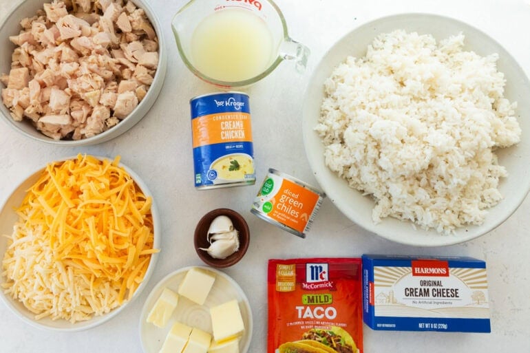 Ingredients for Mexican chicken and rice casserole including chicken, rice, cream cheese, taco seasoning and green chiles