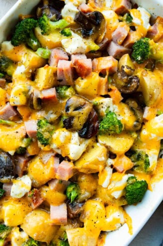 a photo of a baked cheesy ham and potato broccoli casserole