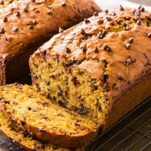 Soft pumpkin banana bread with mini chocolate chips and it smells like fall the minute you stick it in the oven! ohsweetbasil.com