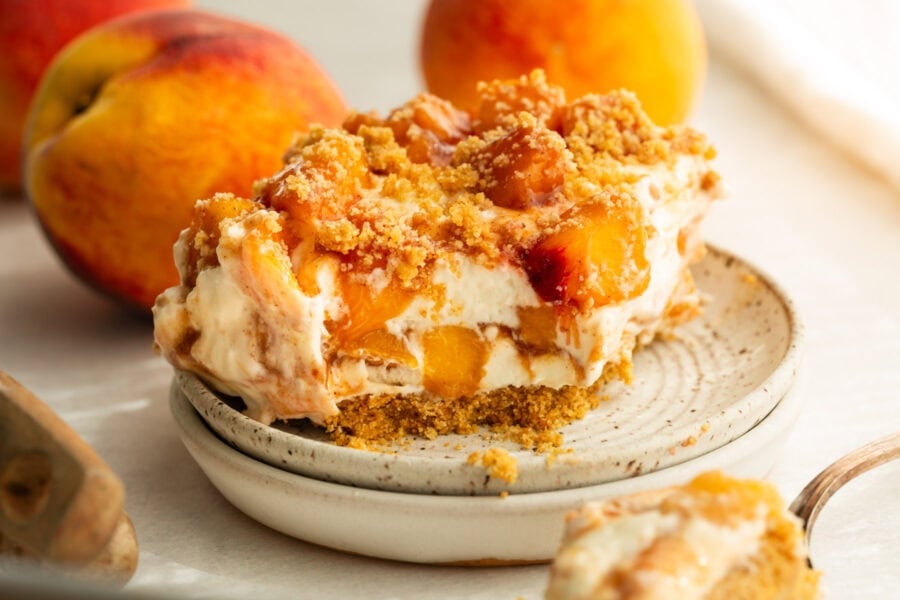 a peaches and cream bar with graham cracker crust