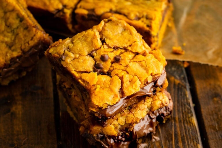 A stack of brown butter nutella stuffed pumpkin bars