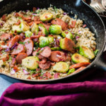 Who doesn't love kielbasa?!! One skillet cheddar broccoli rice with kielbasa is ready in less than 30 minutes! ohsweetbasil.com