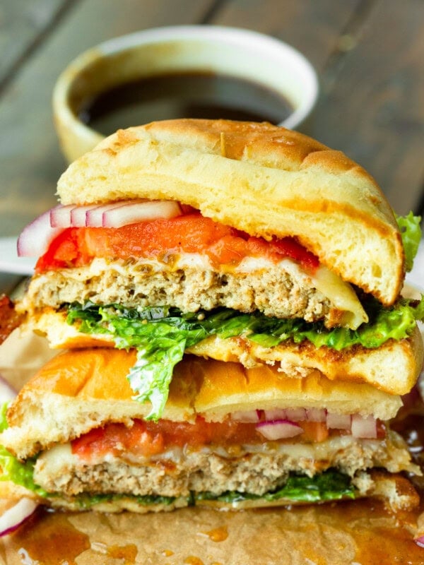 a photo of a pineapple jalapeno turkey burger that has been sliced in half so you can see the inside of the burger