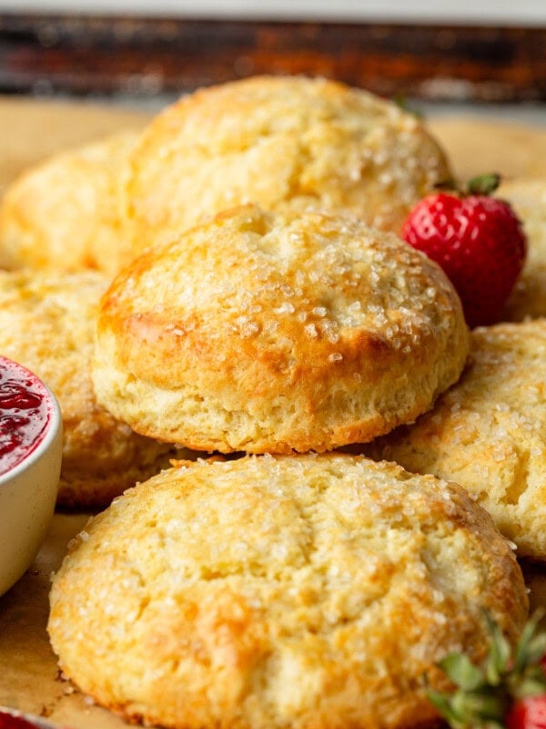 a photo of several golden baked homemade sweet cream biscuits