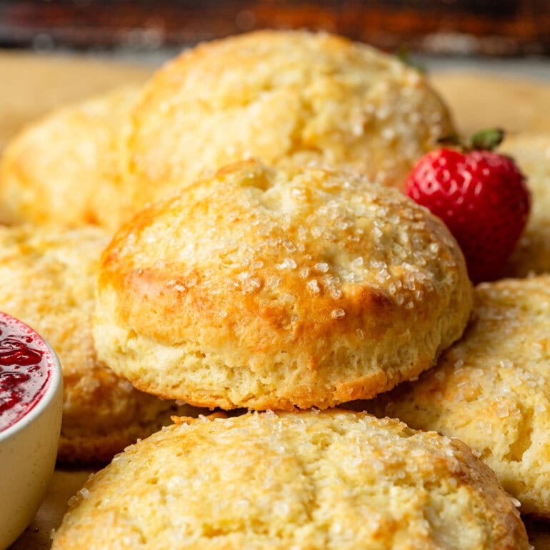 a photo of several golden baked homemade sweet cream biscuits