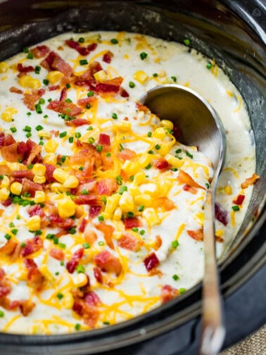 a slow cooker potato broccoli corn chowder with bacon and a silver ladle