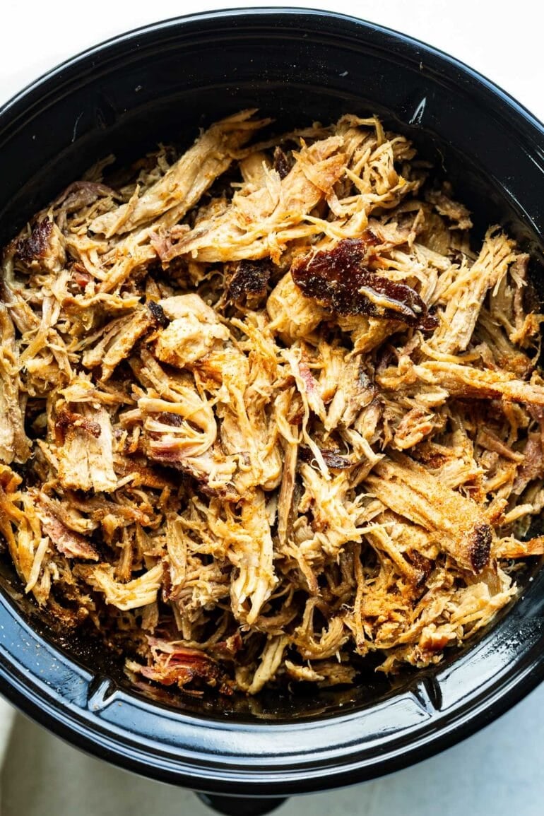 a slow cooker full of juicy, shredded pulled pork