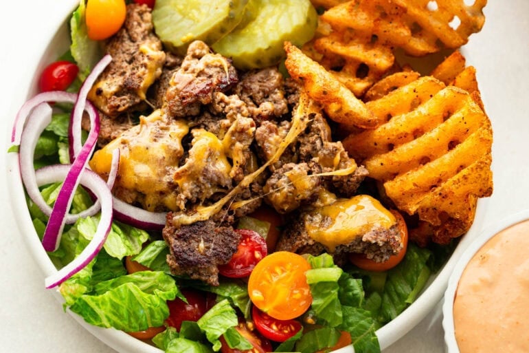 Easy burger bowls topped with crispy smash burger beef, vegetables, cheese and special sauce