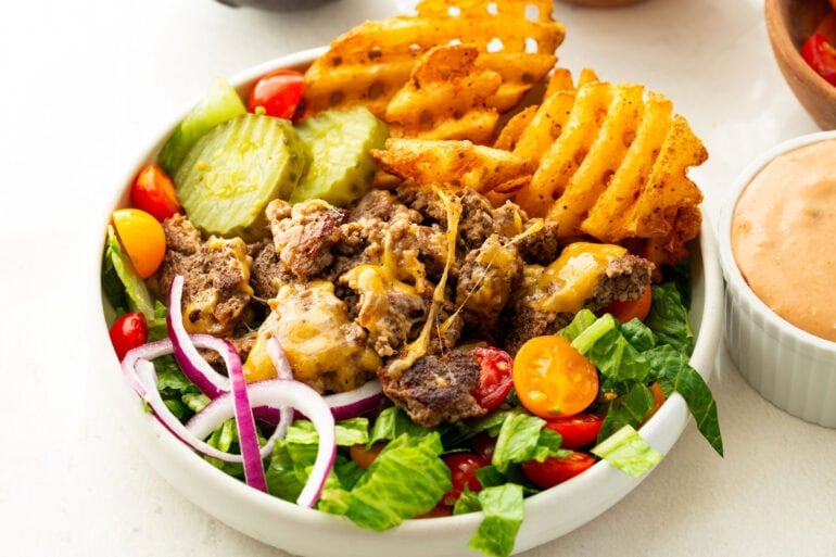 Loaded burger bowls with smash burger beef, crispy fries, lettuce, tomatoes and creamy burger sauce