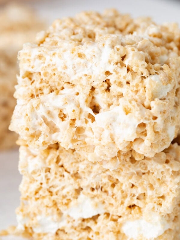Two pieces of rice krispie treats stacked on top of each other.