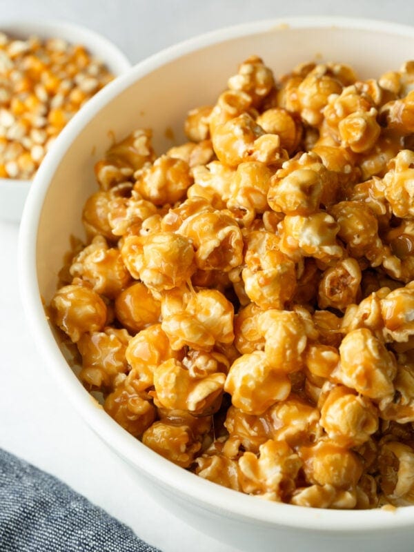 Soft and chewy homemade caramel popcorn piled in a serving bowl