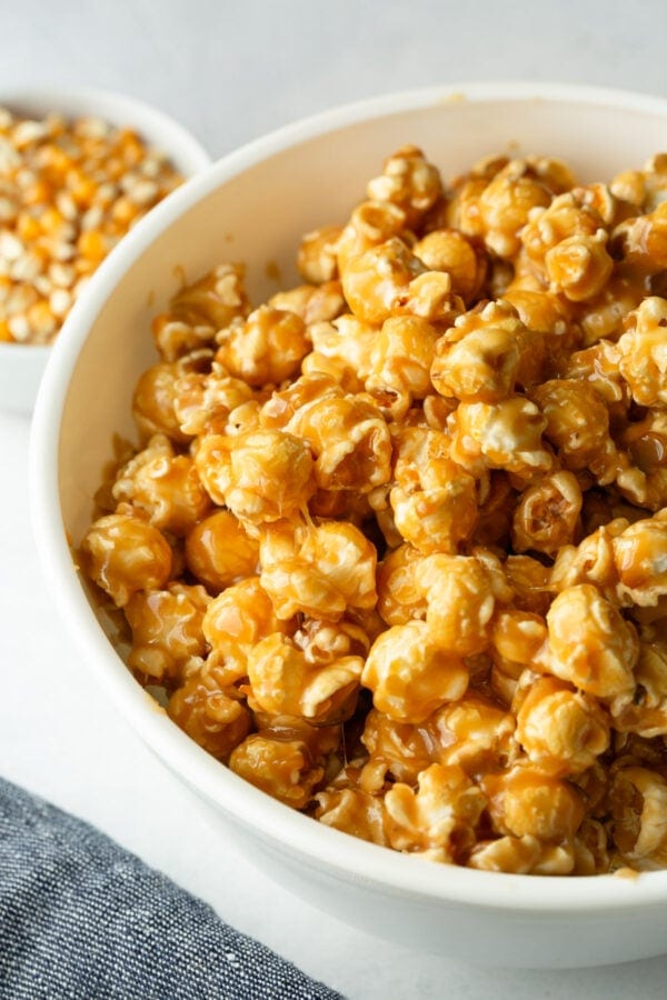 Soft and chewy homemade caramel popcorn piled in a serving bowl
