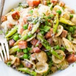 Whether you have leftover ham you need to use or you just don't want a whole ham for Easter this Spring Ham and Asparagus Lemon Cream Pasta is perfection. Such a great weeknight meal!