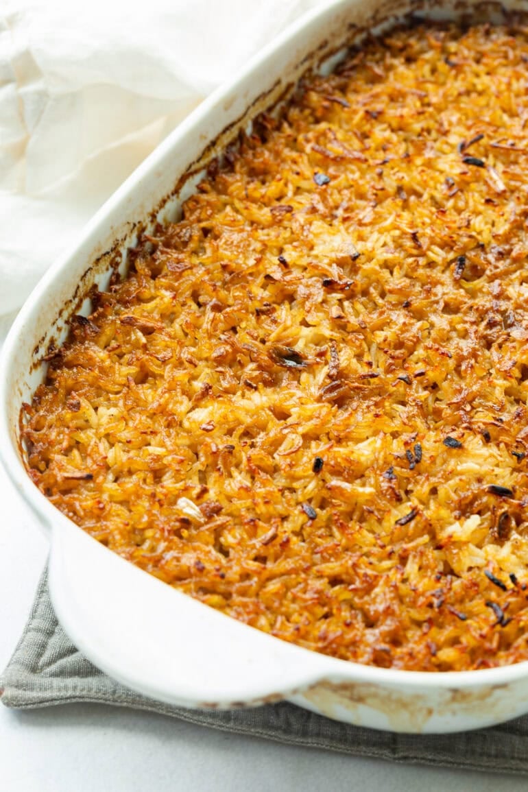 A pan of stick of butter rice cooling on the counter.