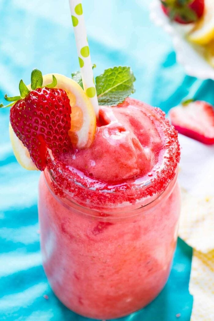 The absolute BEST Frozen Strawberry Lemonade I have ever had and there's a secret to making it! ohsweetbasil.com
