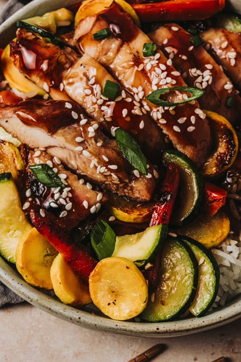 teriyaki chicken strips with sauteed vegetables on white rice
