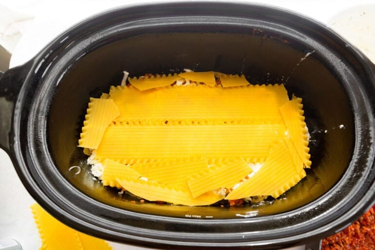 Uncooked lasagna noodles broken to fit inside a crockpot