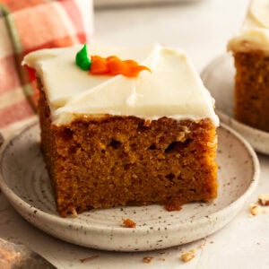 a slice of moist carrot cake with cream cheese frosting