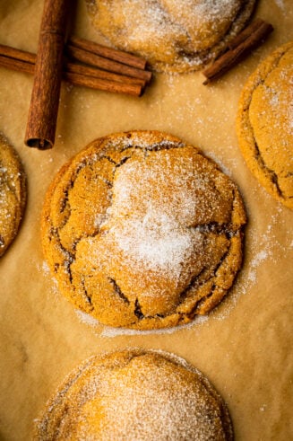 a photo of a soft and chewy molasses cookie topped with sugar and covers in those signature crinkles