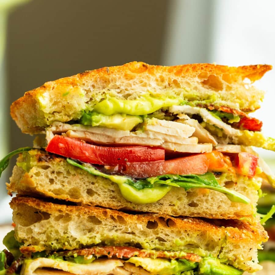turkey bacon avocado sandwich stacked on each other so you can see the cross section