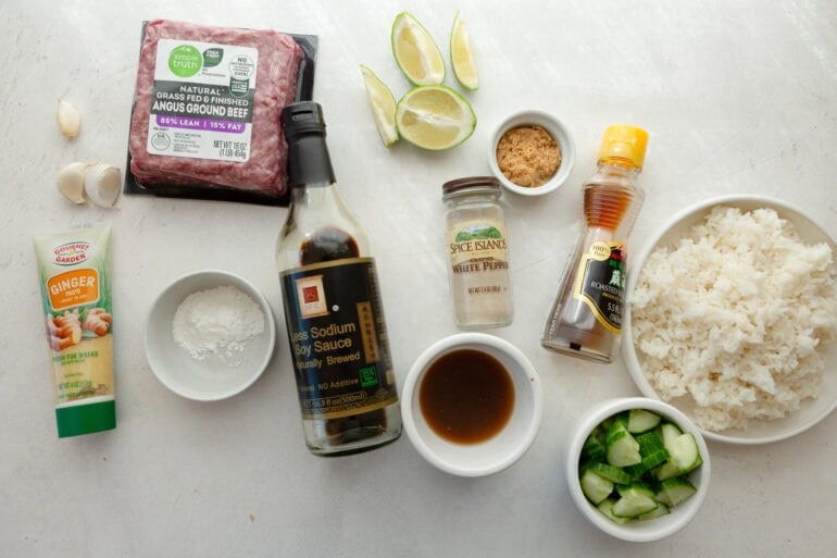 Ingredients for beef broth bowls including ground beef, coconut milk, gochujang, rice, cucumber, lime and cilantro